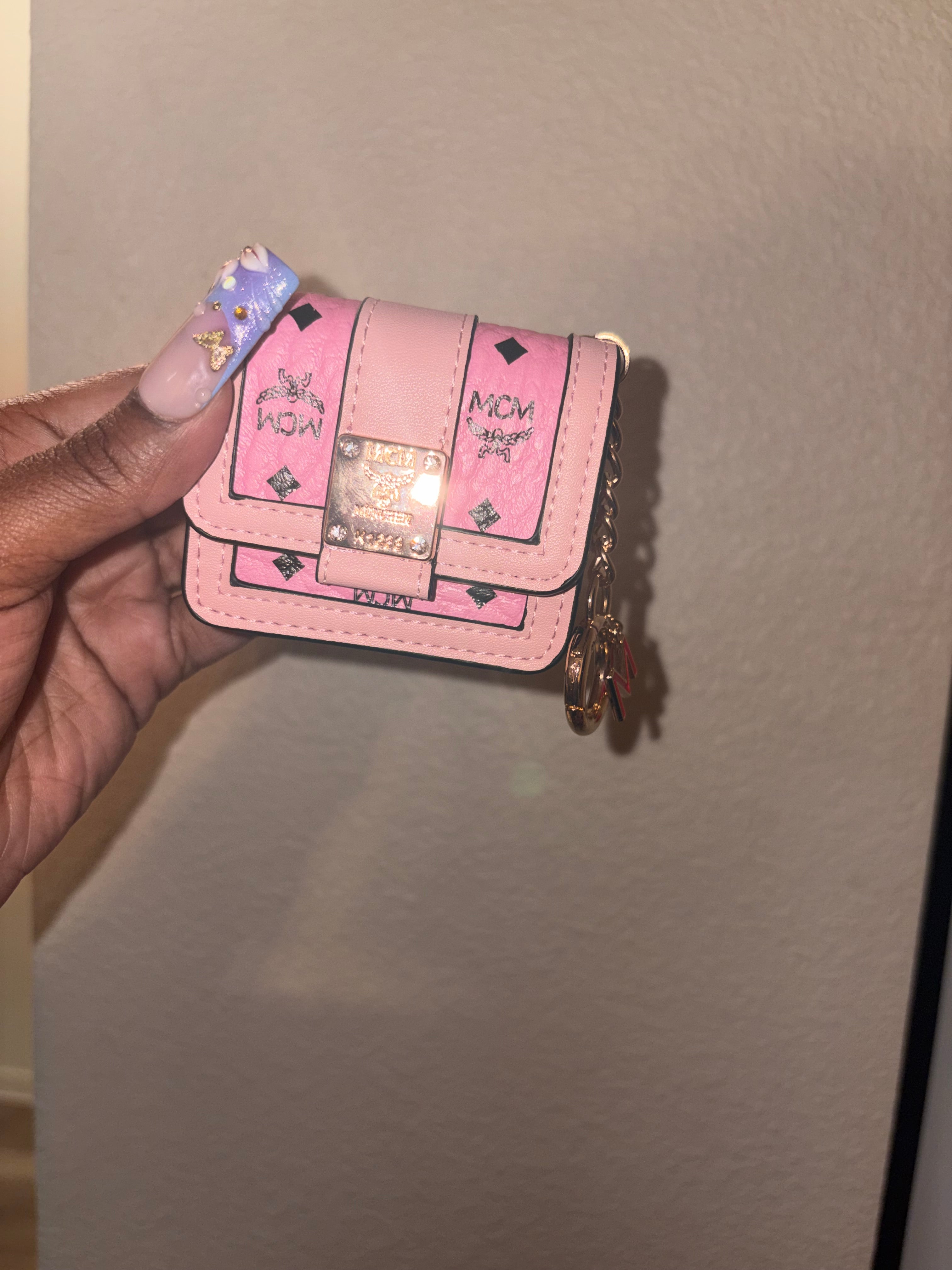 Pink MCM AirPod case